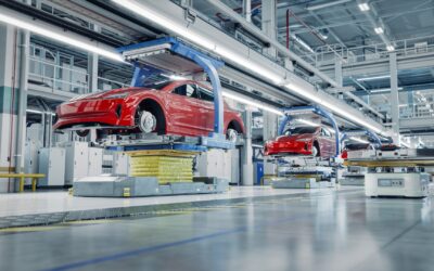 EV Production Line on Advanced Automated Smart Factory. High Performance Electric Car Manufacturing. Car Batteries being Attached to Electric Vehicles on Assembly line. AGV Transport Batteries.